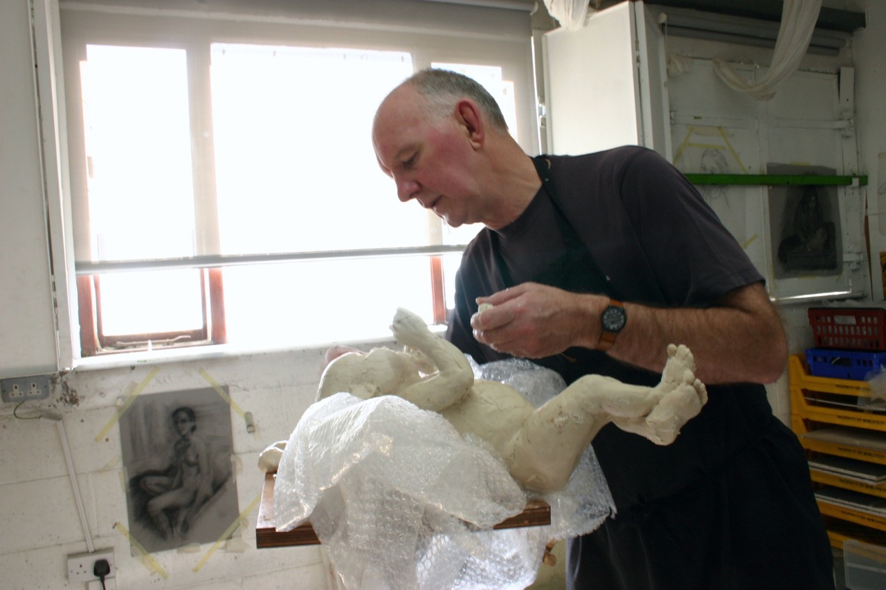 Paddy Campbell making the “baby“ Coco in wax while Emily took a break